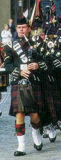 bagpipes in Scotland- Scottish piper playing the bagpipe
